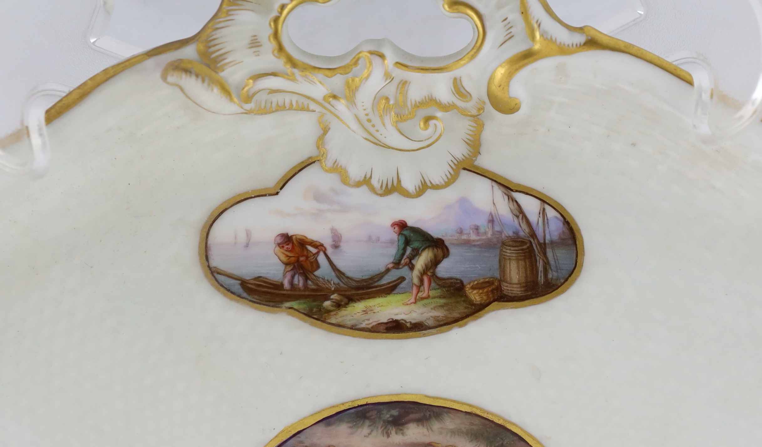 A Meissen porcelain lozenge shaped tray, 19th century, broken and restored